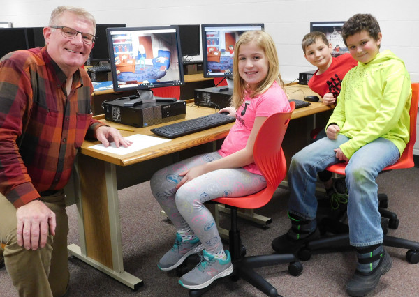 George Klink and students in computer lab at Elmwood Elementary School.