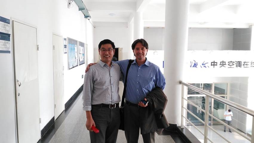 Hora, at Qingdao Technical College on China’s north coast, with Lu Xiaoze, assistant dean of engineering.